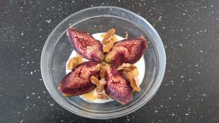 Bowl of UK-grown fresh figs and yoghurt
